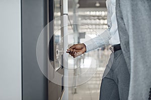 Businessman at coffee machine in car dealership