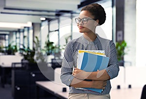 Businessman with colleagues in the background in office