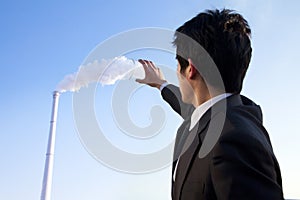 Businessman Collecting Smoke in Beaker