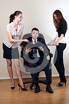 Businessman with collegues in armchair