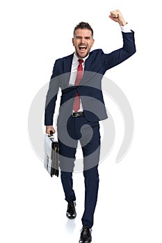 Businessman coming from work and celebrating success