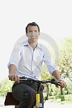 Businessman Commuting On Bicycle