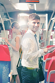 Businessman commuting by bus