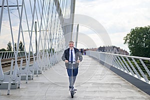 Businessman commuting in the city using a scooter