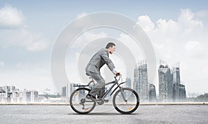 Businessman commuting to work by bike