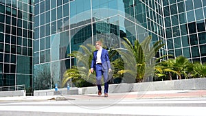 Businessman commuting walking along the financial district
