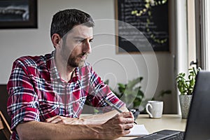 Businessman concentrating on work at home