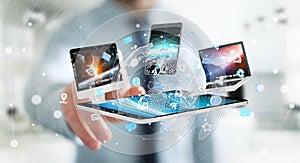 Businessman connecting tech devices to each other 3D rendering