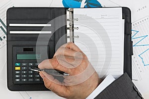 Businessman considers on the calculator