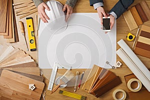 Businessman and construction engineer working at desk