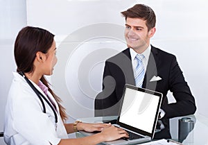 Businessman Consulting Doctor