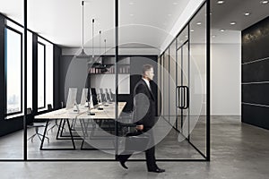 Businessman in contemporary coworking office interior