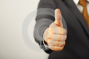 Businessman cool show hand giving thumb up