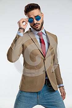 Businessman with cool style against gray studio background