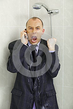Businessman cooling down under a shower