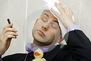 Businessman cooling down under a shower