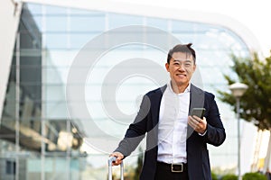 Businessman corresponded in a mobile phone uses the messenger application to communicate with colleagues at a distance