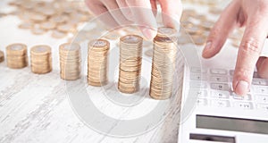 Businessman counting coins and using calculator. Business. Finance