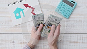 Businessman counting money at table with documents and calculator 4k movie