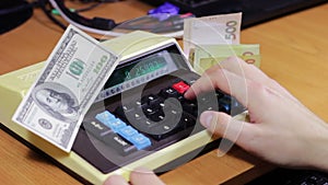 Businessman Counting On a Old Calculator