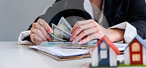 Businessman counting us dollar bill