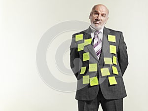 Businessman Covered With Sticky Notes