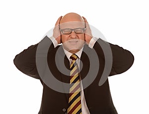 Businessman covering ears