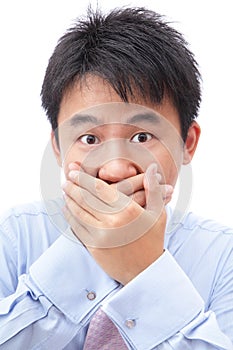 Businessman covering his mouth with hand