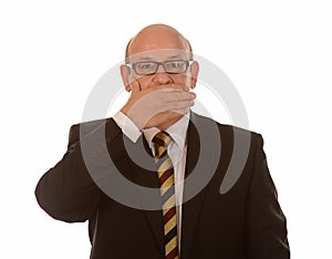 Businessman covering mouth