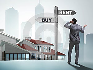 Businessman at crossroads betweem buying and renting