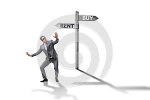The businessman at crossroads betweem buying and renting on white