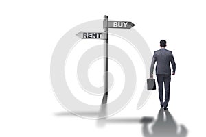 The businessman at crossroads betweem buying and renting on white