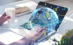 Businessman or cryptocurrency trader analyzing bitcoin market graph chart, using laptop to buy or sell coin, double exposure graph