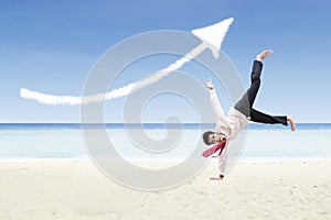 Businessman dance and increase arrow sign cloud at beach