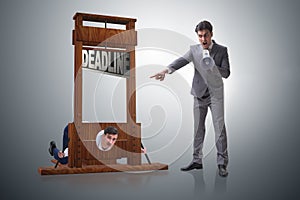 The businessman in deadline concept with guillotine