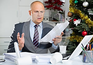 Businessman deals with financial problems in the New Year holiday