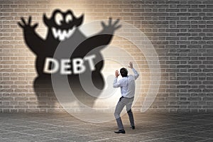 Businessman in debt and loan concept