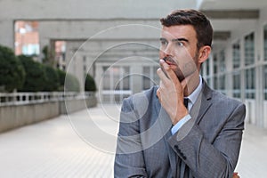 Businessman deep in thoughts close up