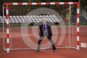 Businessman defending goal photo