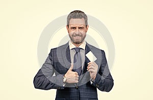 businessman demonstrating credit or debit card. empty plastic business name card. successful ceo