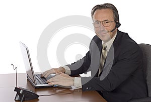 Businessman at the desk with headset