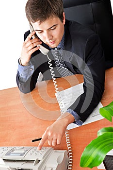 Businessman dialing the number