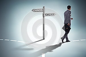 The businessman in difficult choice concept