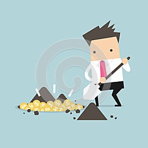 Businessman digging a ground to find treasure coin.