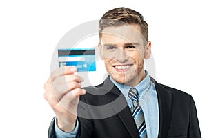 Businessman displaying his cash card