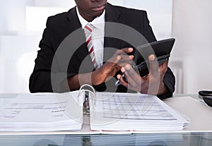 Businessman doing calculations