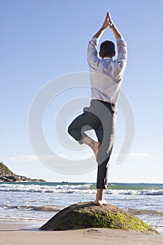 Businessman doing equilibration exercise