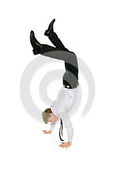 Businessman doing handstand