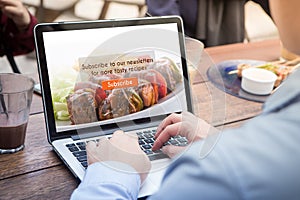 Businessman doing subscribe food blog using laptop / computer