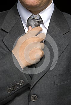 Businessman doing a tie